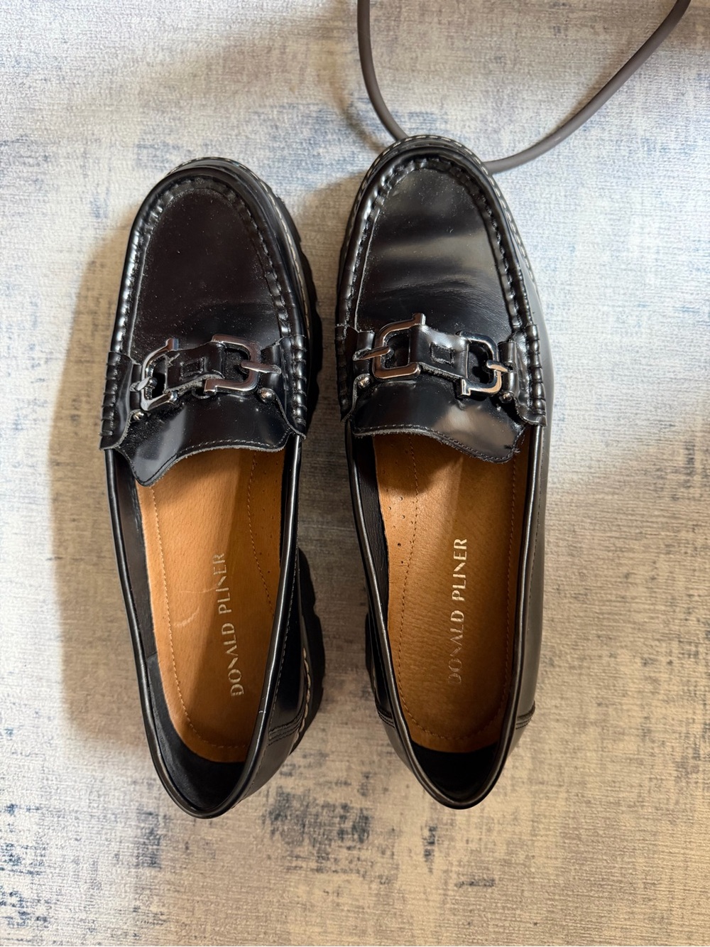 Donald J. Pliner women’s Black Leather Bit-Detail Loafers